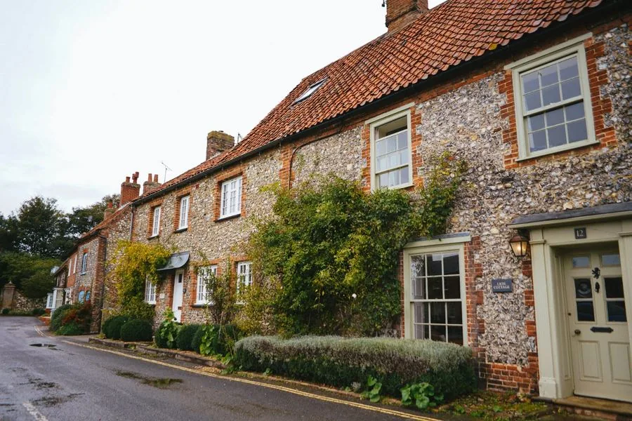 Period flint and brick cottages on a Kent village street, typical of the Faversham hinterland and surrounding rural Swale villages