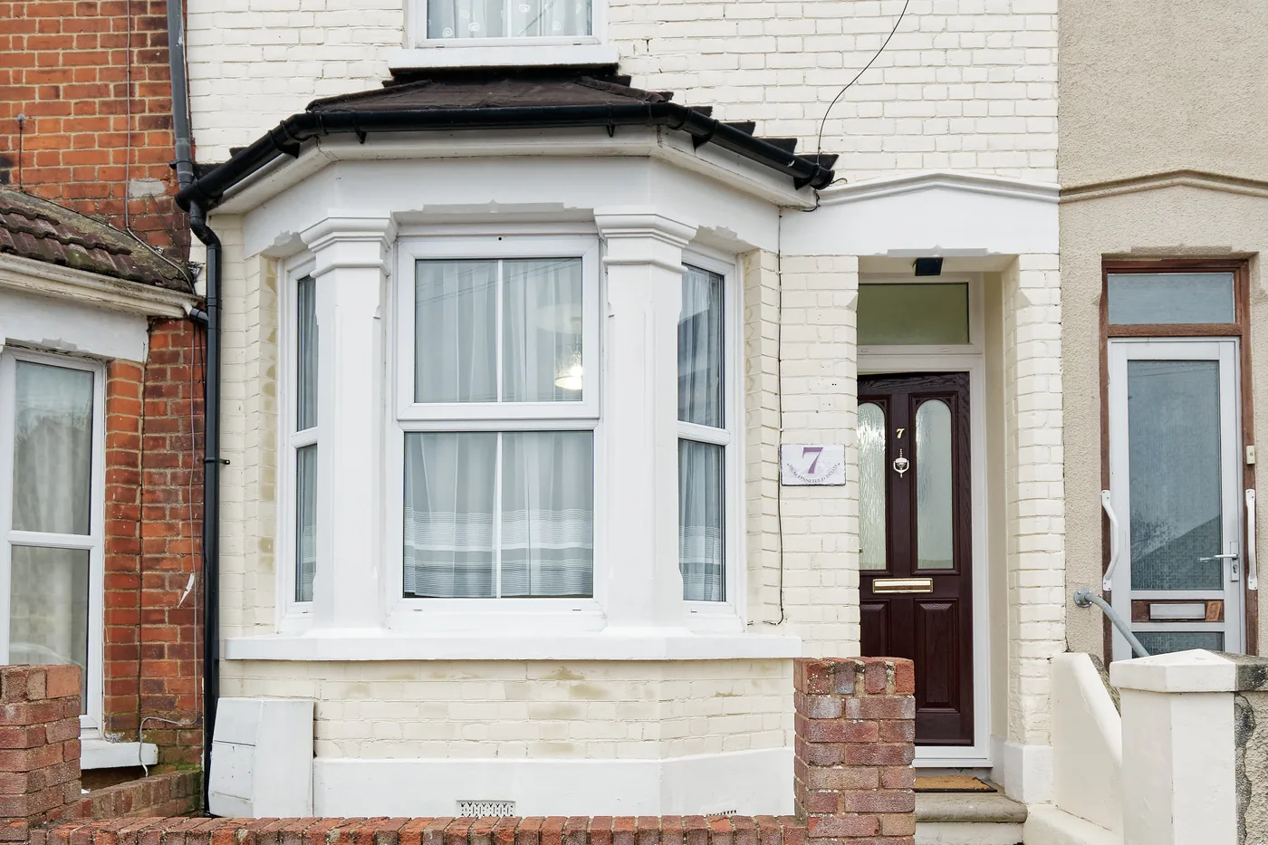 A painted Victorian terraced house with a bay window, typical of the streets across central Rochester, where a large share of our local jobs take place every week